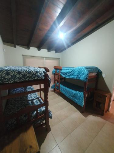 Krevet ili kreveti na sprat u jedinici u okviru objekta Alq Toba- Hermoso Duplex en Bajo la Viña