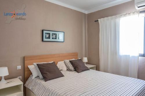 Postel nebo postele na pokoji v ubytování Vivienda Vacacional Manrique