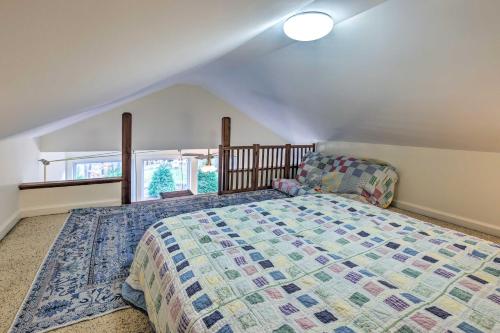 a bedroom with a large bed in a attic at Waterfront Retreat with Boat Dock and Fire Pit! in Southbury