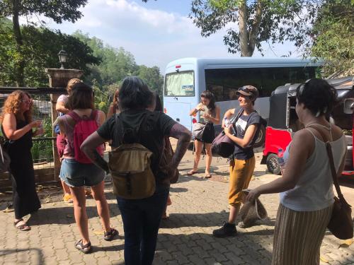 a group of people standing in front of a bus at Funk Bunks - Mount View in Kandy