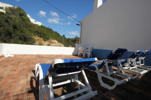 a group of chairs sitting on a roof at T2 Casa dos Arcos by Seewest in Salema