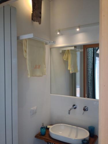 a bathroom with a sink and a mirror at Agriturismo Borgo Laurice in Torgiano