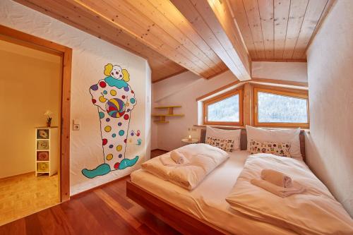 a bedroom with a large bed in a room at Marys Holiday Penthouse in Saalbach Hinterglemm