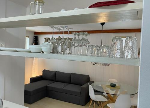 a living room with a couch and a table with glasses at Condo En Quatre Temps in Beaupré