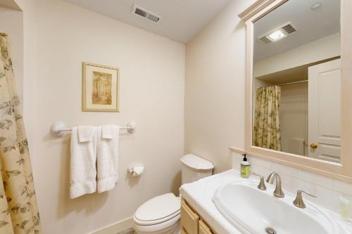 a bathroom with a sink and a toilet and a mirror at Mountain Lake Getaway (B101) in Twin Beaches
