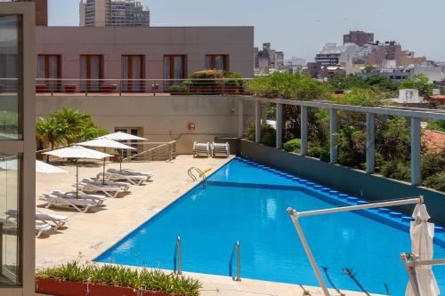 a swimming pool on the roof of a building at Quinto Centenario Hotel in Córdoba