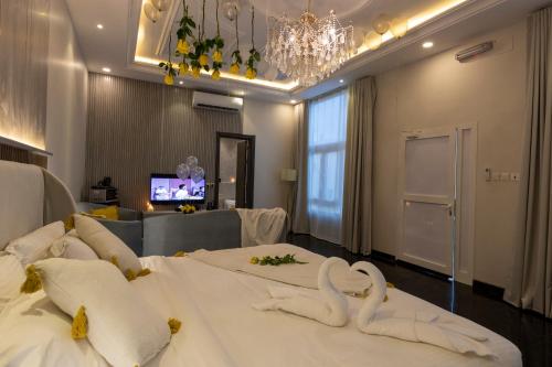 a hotel room with two beds with swans on them at Arayik Resort in Taif