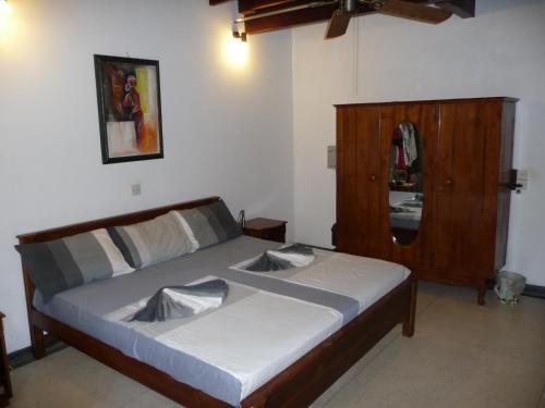 Postel nebo postele na pokoji v ubytování Cinnamon Bungalow