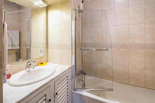 a bathroom with a sink and a shower at Private 2 Bed Apartment in Albufeira Old Town in Albufeira