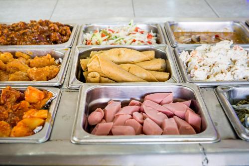 a tray filled with different types of food at Hotel Raldos Inn in Salamanca