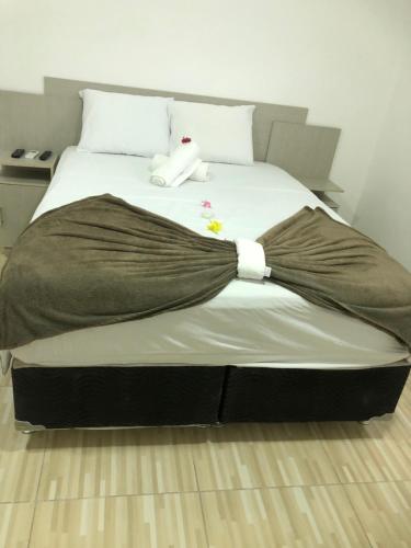 Een bed of bedden in een kamer bij Villa Brilho do Sol