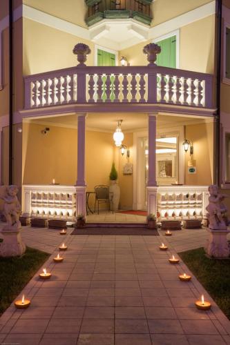 a patio with candles in front of a house at Hotel Doge in Vicenza