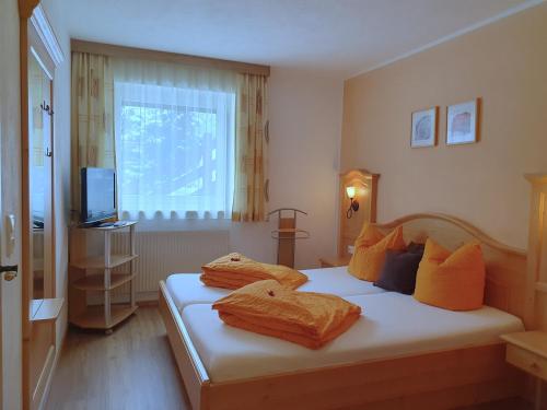 Cama o camas de una habitación en Ferienheim Gasteig