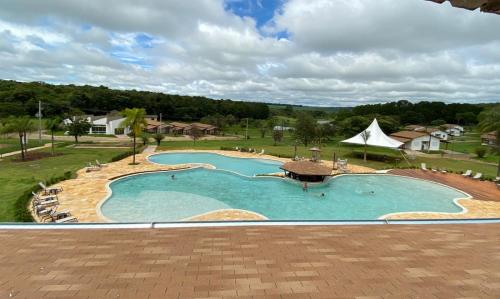 an image of a swimming pool at a resort at Vale Das Águas Fazenda Resort in Águas de Santa Barbara