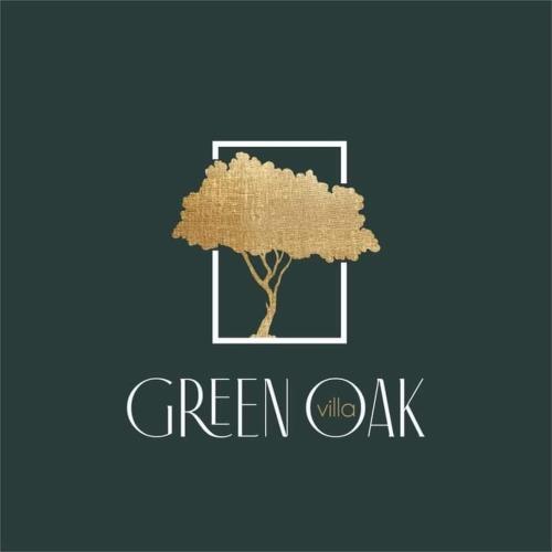 a tree in a square with the words green vs oak at Green Oak Villa in Orthoniaí