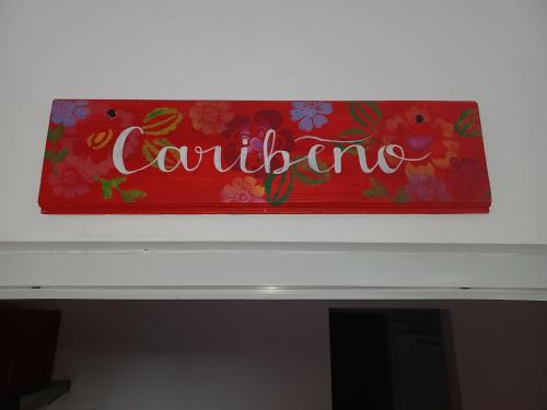a sign on the top of a fireplace at Doña Mayra Aparta Hotel in Las Terrenas