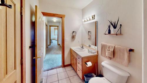 a bathroom with a white toilet and a sink at The Rock #3461 in Moab