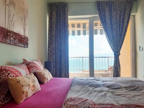 En eller flere senge i et værelse på Apartments in Villa Azra