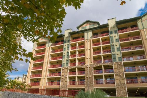 an apartment building with red balconies at RiverStone Condo Resort & Spa in Pigeon Forge