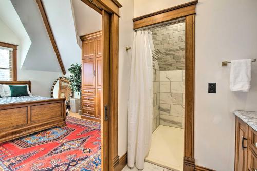 a bathroom with a walk in shower next to a crib at Historic Guest House on Castle Kimble Estate! in Manhattan