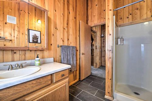 a bathroom with a sink and a shower and a tub at Star Valley Ranch Cabin Getaway Hot Tub! in Thayne