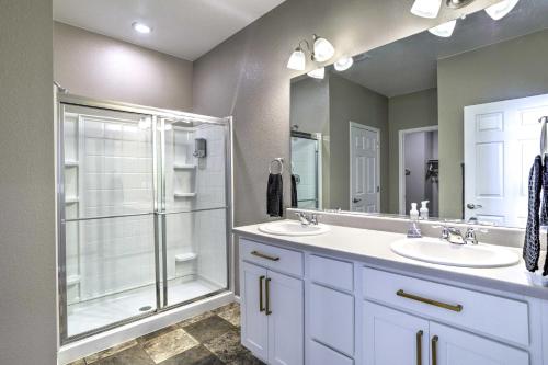 a bathroom with two sinks and a shower at Spacious Aurora House with Yard about 10 Mi to DIA! in Aurora
