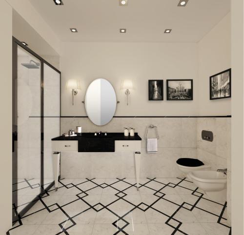 a bathroom with a toilet and a sink and a mirror at Duomo Rooms in Milan