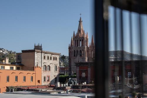 a view of a cathedral from a window at Casa 1810 Hotel Boutique in San Miguel de Allende