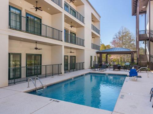 a swimming pool in front of a building at King Suite @ 400 Ocean Suites in King City
