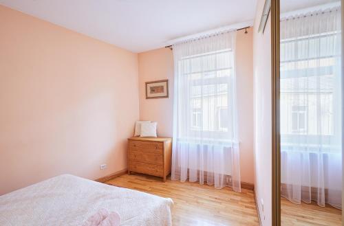 a bedroom with a bed and a window at Kurpių gatvė in Kaunas