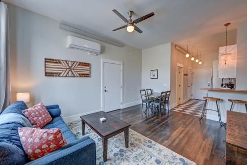 a living room with a blue couch and a table at South Main Residences by Surf Hotel in Buena Vista