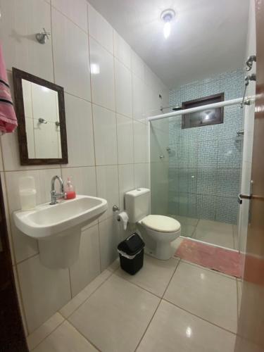 a bathroom with a sink and a toilet and a shower at Beach House Sao Jose in São José da Coroa Grande