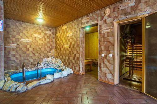 a bathroom with a sink in a brick wall at Milana in Bukovel