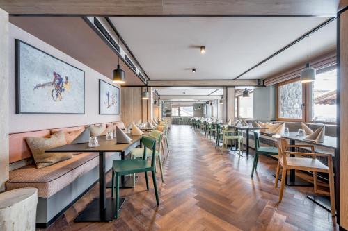 a dining room with tables and chairs at The Moss - Your unique hideaway in Obergurgl