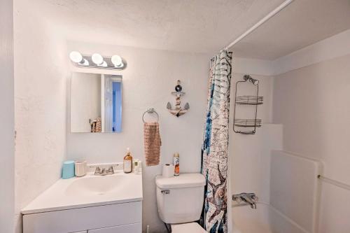a bathroom with a toilet and a sink at Everglades City Cabin Dock and Heated Pool! in Everglades City