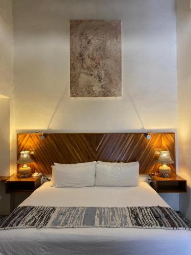 Postel nebo postele na pokoji v ubytování NaNa Vida Hotel Morelia