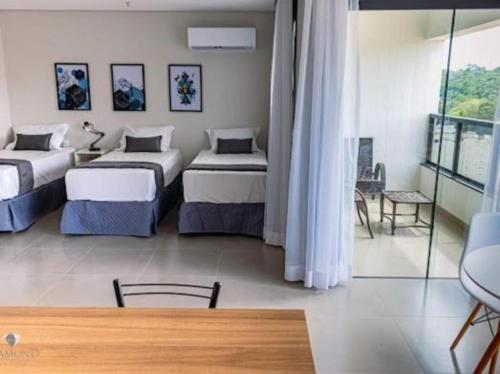 Postel nebo postele na pokoji v ubytování Diamond Hotéis e Flats