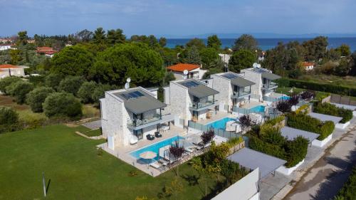 an aerial view of a house with a swimming pool at White Pearl in Pefkohori
