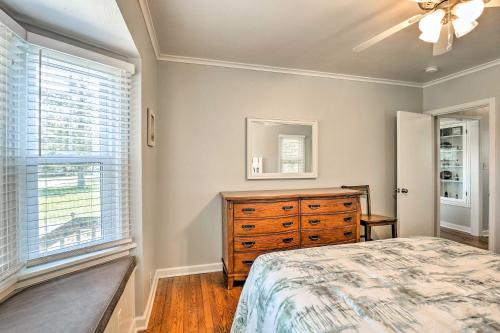 a bedroom with a bed and a dresser and a window at Modern Sturgeon Bay Home by Potawatomi State Park! in Sturgeon Bay