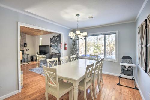 a dining room and living room with a table and chairs at New Hampshire Home with Private Beach, Dock and Rafts! in Barnstead