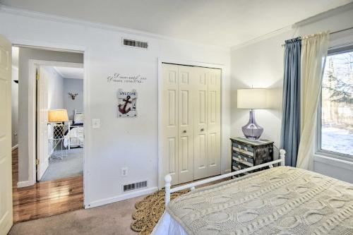 a bedroom with a bed and a window at New Hampshire Home with Private Beach, Dock and Rafts! in Barnstead