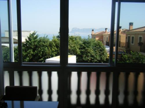 a view from a window looking out at the ocean at Hotel Mirador in Algeciras