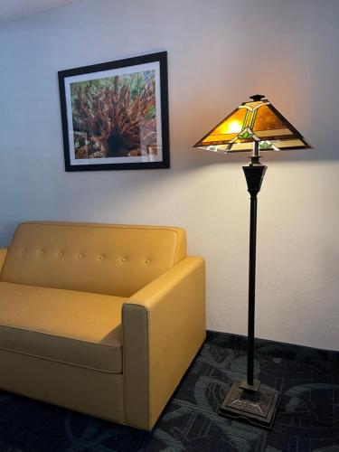 a living room with a couch and a lamp at The Historic Brookdale Lodge, Santa Cruz Mountains in Brookdale