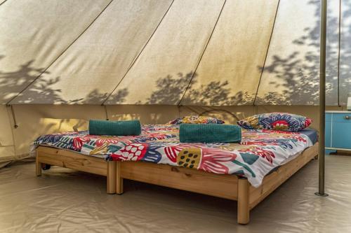 a bed with a canopy in a room at Mini kamp Perla in Prvić Luka