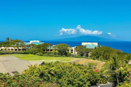 a view of a resort with the ocean in the background at Ho'olei Ocean View by Coldwell Banker Island Vacations in Wailea