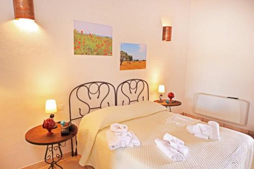 Ένα ή περισσότερα κρεβάτια σε δωμάτιο στο Agriturismo Masseria Alberotanza