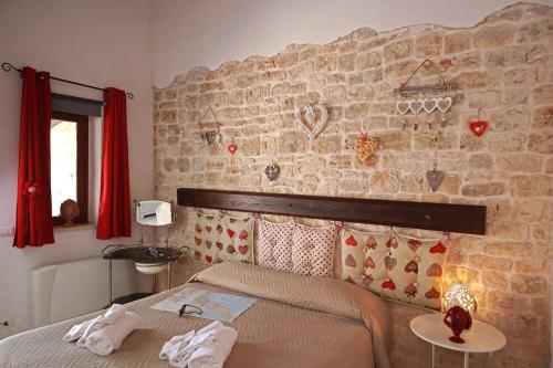 Ένα ή περισσότερα κρεβάτια σε δωμάτιο στο Agriturismo Masseria Alberotanza