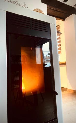 an open door to a room with a table at L'antre du loup in Stavelot