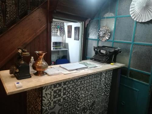 a room with a counter with a sewing machine at HOTEL Boutique Casablanca Adrogué in Adrogué