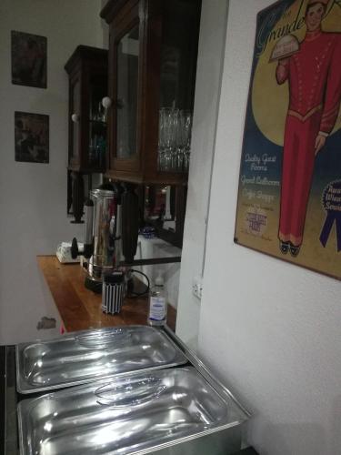 a kitchen with a stainless steel sink in a kitchen at HOTEL Boutique Casablanca Adrogué in Adrogué